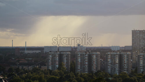 Video - Cityscape with residential buildings and green trees under a cloudy sky. Copenhagen, Denmark