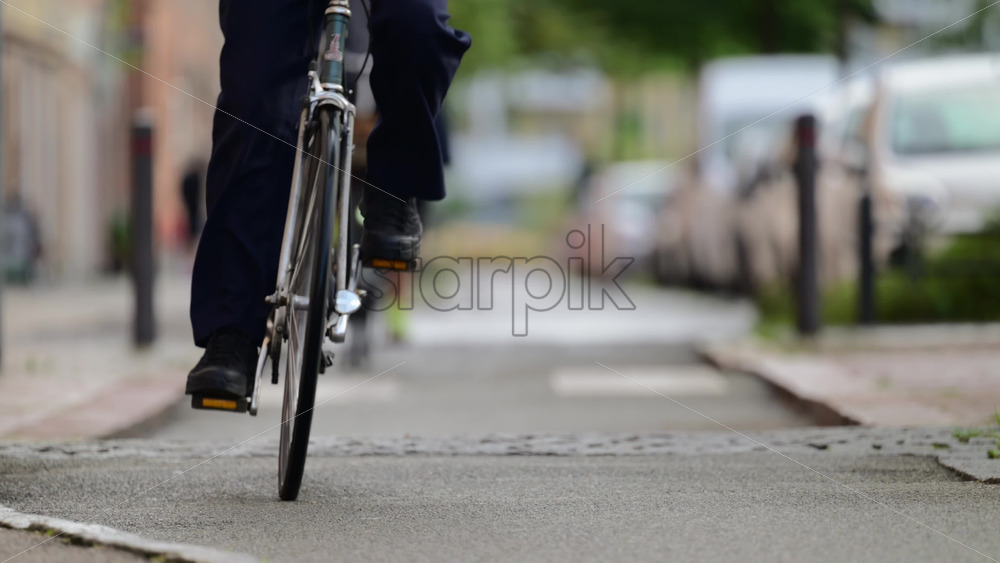 Video - Cyclists riding on a street bike lane in slow motion. . Copenhagen, Denmark