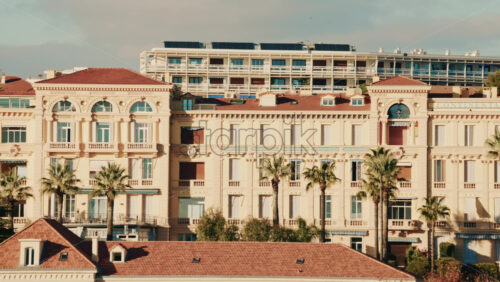 Video - Cannes, France - December 18, 2025: Continental luxury hotel facade with palm trees and refined architecture