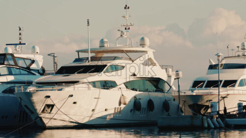 Video - Modern luxury yachts docked side by side at a marina on the French Riviera