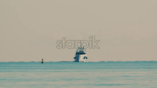 Video - A navigation buoy in the foreground and a yacht on the horizon in the Mediterranean Sea near France