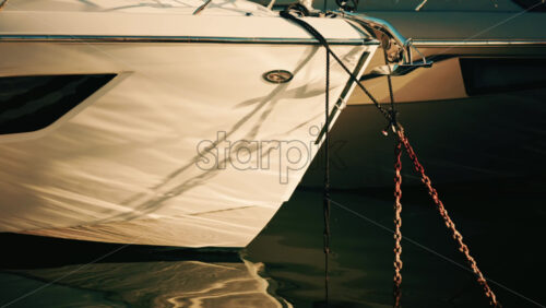 Video - Close up of the bow of a luxury yacht with mooring ropes and metal fittings visible