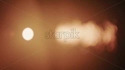 Video - Abstract, out of focus shot of the sun and its reflection on the sea. Vertical