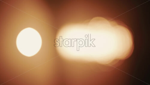 Video - Abstract, out of focus shot of the sun and its reflection on the sea. Vertical