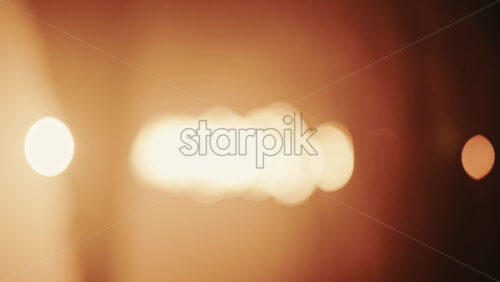 Video - Abstract, out of focus shot of the sun and its reflection on the sea. Vertical