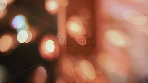 Video - Abstract composition of warm holiday lights creating a glowing bokeh pattern, with no distinct objects in focus