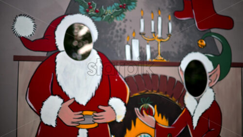 Video - Festive Christmas stand-in board featuring Santa Claus and an elf with face cut outs
