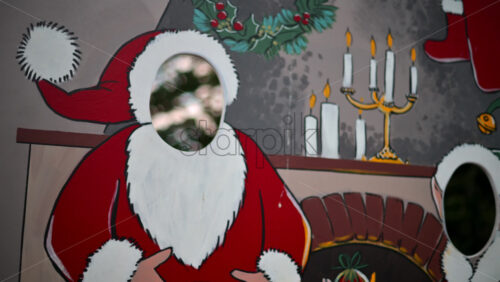 Video - Festive Christmas stand-in board featuring Santa Claus with face cut out
