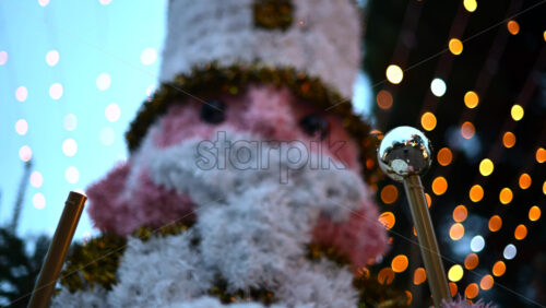 Video - Decorative Christmas nutcracker soldier figure displayed outdoors with trees in the background