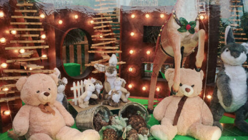Video - A festive shop window display featuring plush toys and Christmas decorations
