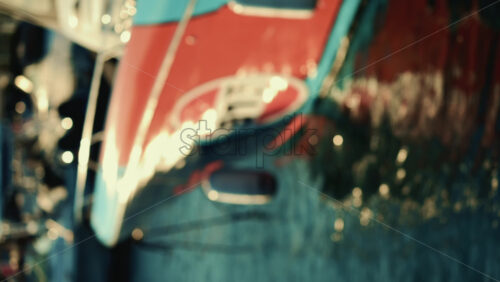 Video - Soft focus shot of a boat bow partially reflected in the water. Vertical