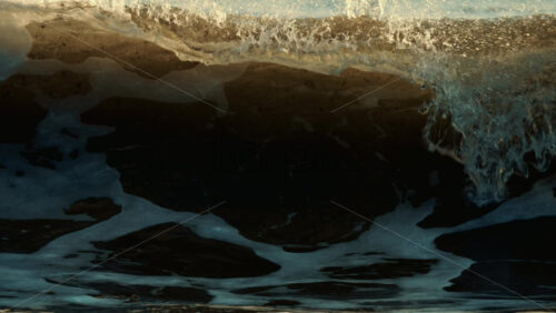 Video - Ocean waves breaking and foaming as they approach the shoreline