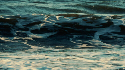 Video - Ocean waves breaking and foaming as they approach the shoreline