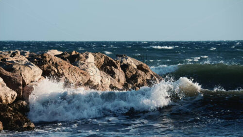 Video - Ocean waves breaking and foaming as they approach the shoreline
