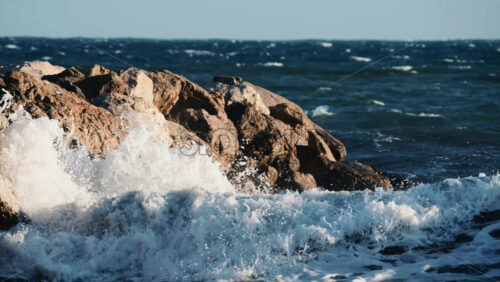 Video - Ocean waves breaking and foaming as they approach the shoreline