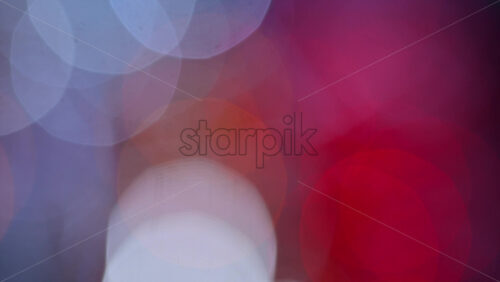Video – Abstract composition of colorful out of focus lights blending pink, blue, and white tones - Starpik Stock
