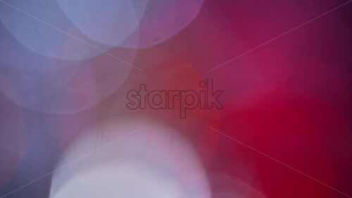 Video – Abstract composition of colorful out of focus lights blending pink, blue, and white tones - Starpik Stock