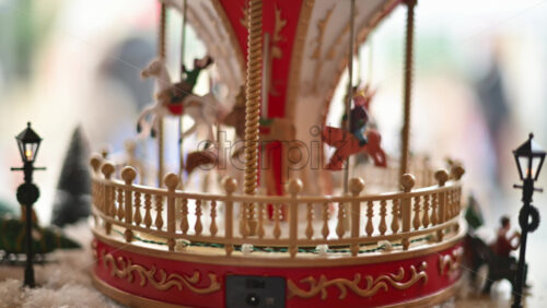 Video – Close up of a miniature vintage carousel with decorative horses and ornate details - Starpik Stock