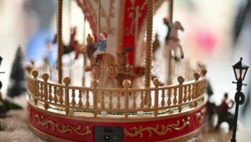 Video – Close up of a miniature vintage carousel with decorative horses and ornate details - Starpik Stock