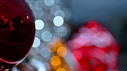 Video – Decorated Christmas tree ornaments in focus with illuminated festive installations blurred in the background - Starpik Stock