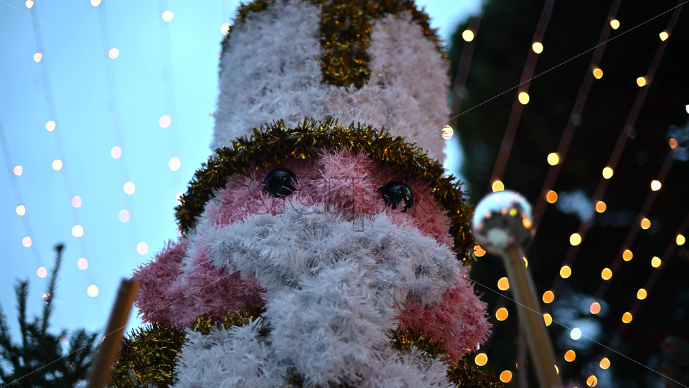 Video – Decorative Christmas nutcracker soldier figure displayed outdoors with trees in the background - Starpik Stock