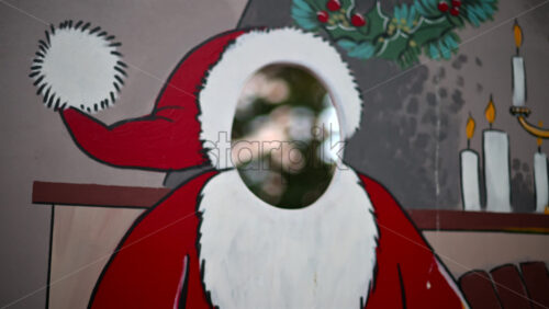 Video – Festive Christmas stand-in board featuring Santa Claus with face cut out - Starpik Stock