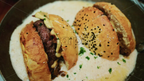 Video – French burger in a special goat milk sauce on a pan - Starpik Stock