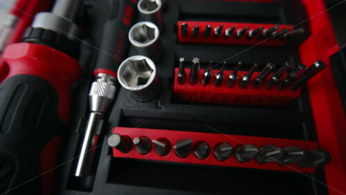 Close up shot of a professional tool kit with screwdriver bits and sockets neatly organized