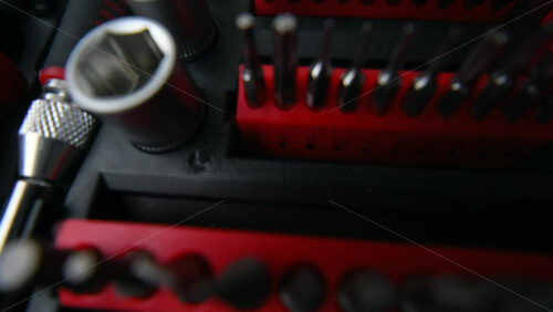 Close up shot of a professional tool kit with screwdriver bits and sockets neatly organized