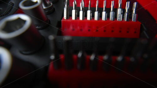 Close up shot of a professional tool kit with screwdriver bits and sockets neatly organized