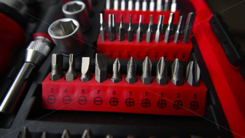 Close up shot of a professional tool kit with screwdriver bits and sockets neatly organized