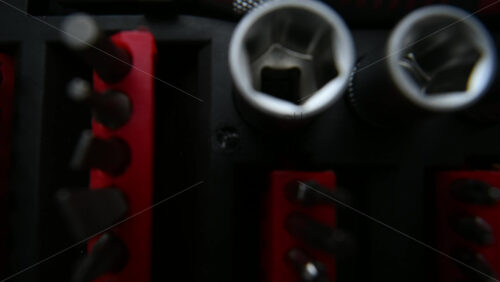 Close up shot of a professional tool kit with screwdriver bits and sockets neatly organized