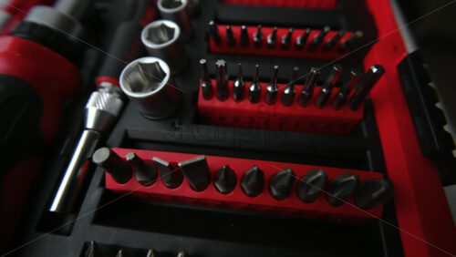 Close up shot of a professional tool kit with screwdriver bits and sockets neatly organized