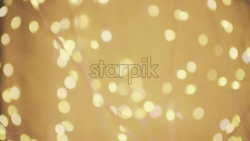 Soft defocused golden lights creating a warm bokeh background