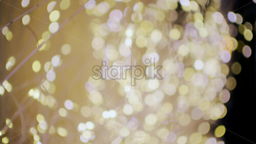 Soft defocused golden lights creating a warm bokeh background