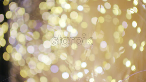 Soft defocused golden lights creating a warm bokeh background