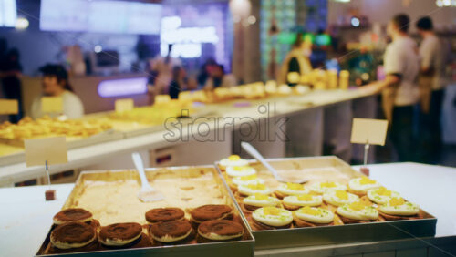 Fresh pastries arranged on trays at a modern bakery counter