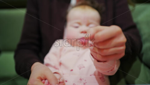 Mother cuddling her baby close to her face in a tender moment