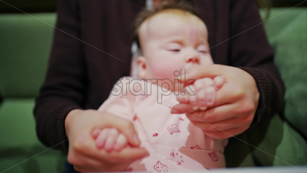 Mother cuddling her baby close to her face in a tender moment