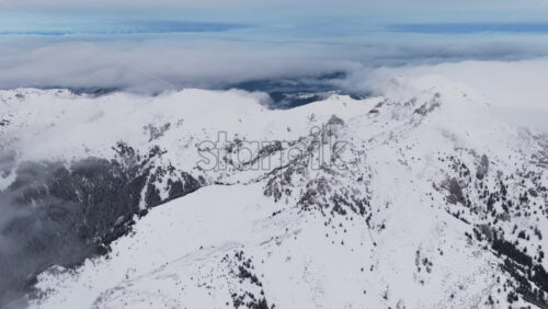 Panoramic aerial drone view of winter landscape in the mountains. Transylvania, Mount Ciucas in Romania