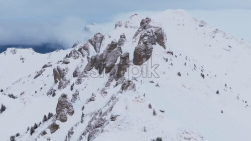 Panoramic aerial drone view of winter landscape in the mountains. Transylvania, Mount Ciucas in Romania