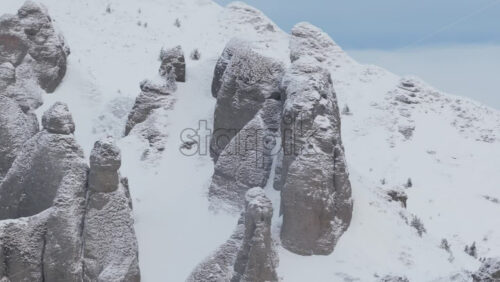 Panoramic aerial drone view of winter landscape in the mountains. Transylvania, Mount Ciucas in Romania