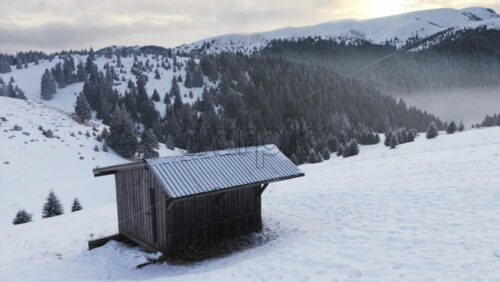 Panoramic aerial drone view of winter landscape in the mountains. Transylvania, Mount Ciucas in Romania