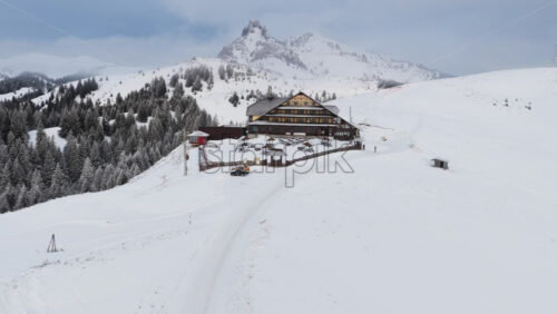 Panoramic aerial drone view of Ciucas Cabin in the mountains. Transylvania, Carpathian mountains in Romania