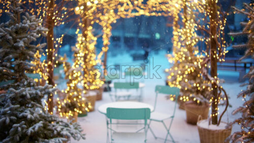 Wide view of an outdoor cafe decorated with Christmas lights forming a glowing archway - Starpik Stock