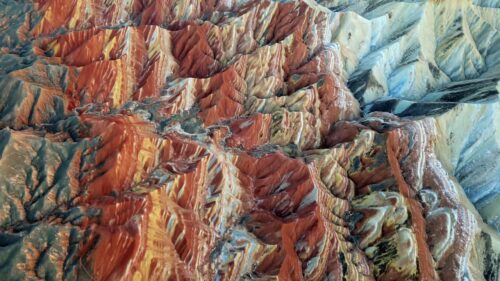 Video - Aerial drone view of Sekumpul Waterfall in Buleleng, North Bali, Indonesia. Twin streams cascade down a towering jungle cliff into a natural rock pool surrounded by dense tropical rainforest
