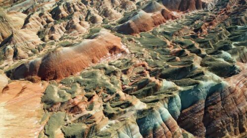 Video - Aerial drone view of eroded sandstone ridges in Zhangye Danxia National Geopark, Gansu, China