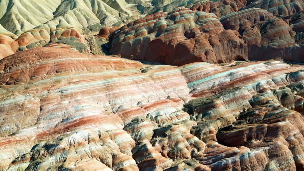 Video - Aerial drone view of eroded sandstone ridges in Zhangye Danxia National Geopark, Gansu, China