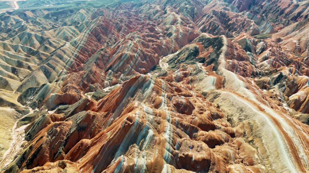 Video - Aerial drone view of eroded sandstone ridges in Zhangye Danxia National Geopark, Gansu, China