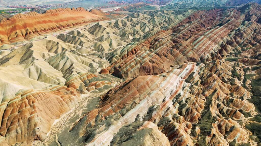 Video - Aerial drone view of eroded sandstone ridges in Zhangye Danxia National Geopark, Gansu, China